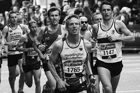 grayscale photography of man running on field thumbnail
