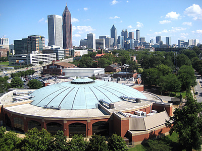 brown and beige dome building surrounded by trees thumbnail