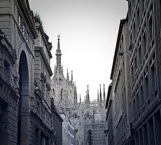 View of buidings, Gothic architectural church and sky in alley in Milan, Italy thumbnail