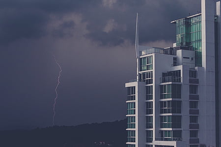 white highrise building under gray skjy thumbnail