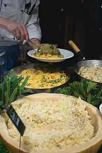 Cook scoops risotto thumbnail