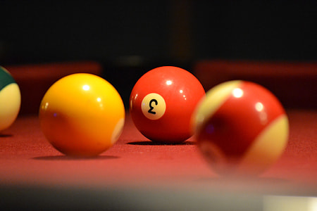 selective focus photography of 3 pool ball thumbnail