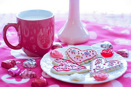 purple and white ceramic mug beside round white ceramic saucer thumbnail
