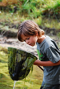 boy holding fishing net thumbnail