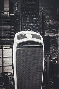 grayscale photography of white and black buildings thumbnail