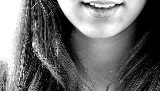 grayscale photography of woman sticking her mouth open thumbnail