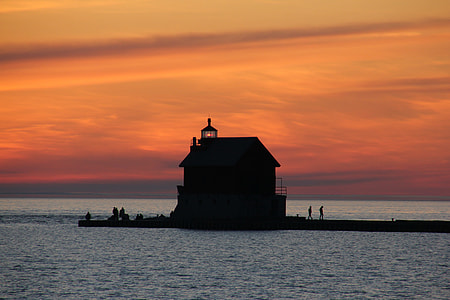 house near body of water during sunset thumbnail