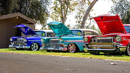 three assorted-color muscle cars thumbnail