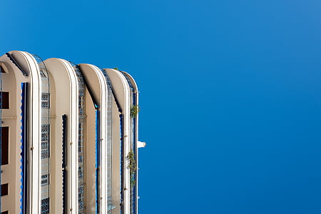 high rise building under blue sky thumbnail