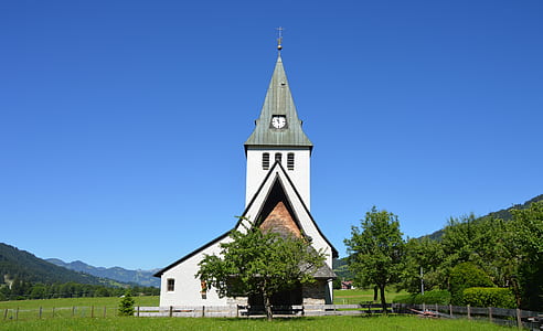 White and Grey Church Near Trees Under Clear Blue Sky during Daylight thumbnail