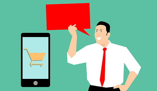 Marketing man talking about social media marketing with mobile device. Shopping card and empty speech bubble. thumbnail