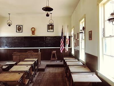 tilt shift photography of classroom with desks thumbnail