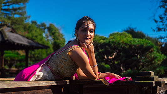 woman leaning on bench using her elbow thumbnail