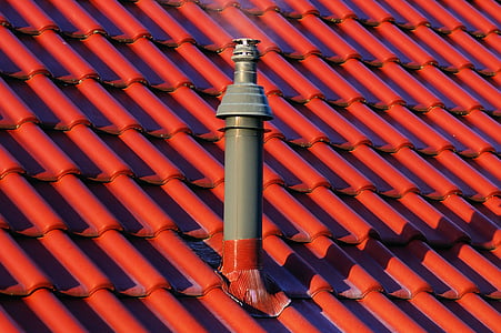 gray and red tube pipe on roof thumbnail