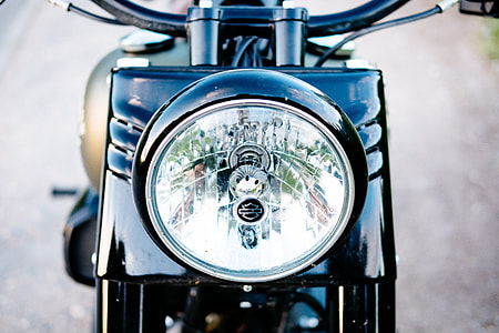 round motorcycle headlight in macro shot thumbnail