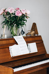 Old piano with sheet music thumbnail