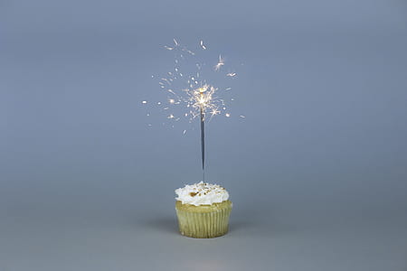 sparklers on cupcake with white icing thumbnail
