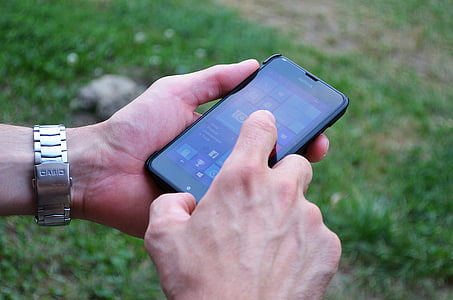 person using Nokia smartphone at daytime thumbnail