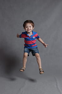 boy in blue and red polo shirt and blue denim boat shorts thumbnail