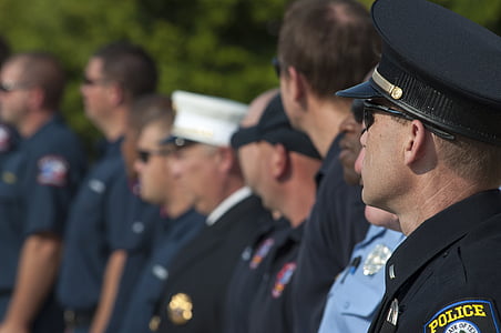 police officers standing in line during daytime thumbnail