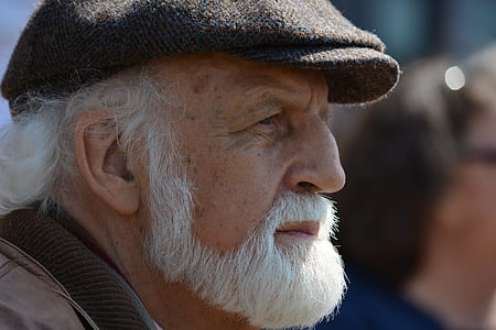 man wearing black newsboy cap thumbnail