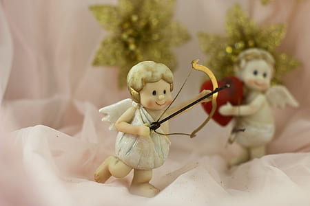 angel with bow ceramic figurine thumbnail