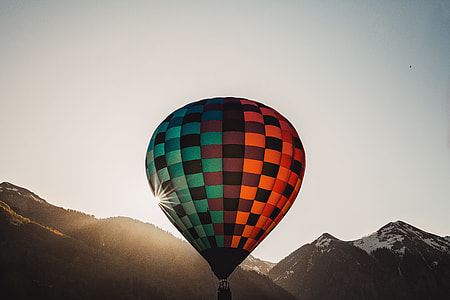 red, brown, and teal hot air balloon thumbnail