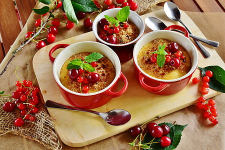 three red bowls filled with food thumbnail