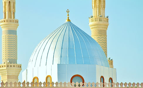 blue and yellow mosque with gold finial thumbnail