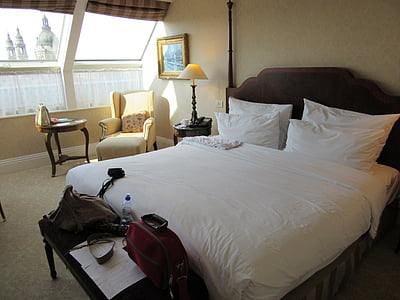 closeup photo of brown wooden bed frame and mattress thumbnail