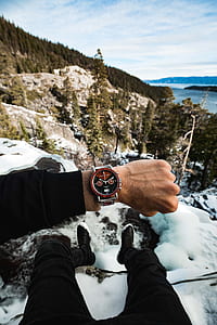 person showing chronograph watch thumbnail