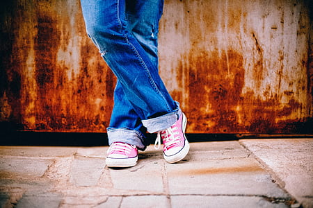 person wearing blue jeans and pink Converse low-top sneakers thumbnail