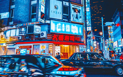 time lapse photography of cars beside buildings thumbnail