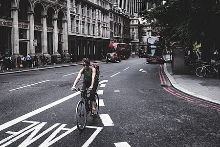 man riding bicycle on road thumbnail