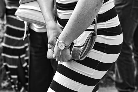 grayscale photo of woman wearing striped dress thumbnail