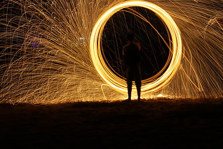 time lapse photography of boy in front of firework thumbnail