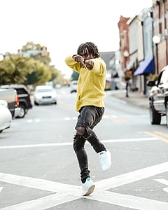 man dancing on road thumbnail