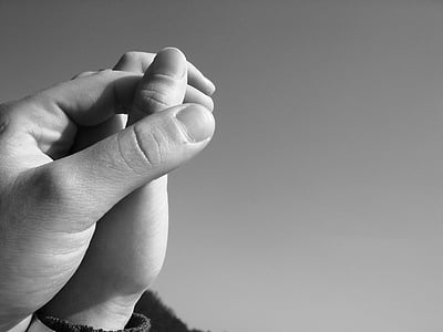 grayscale photography of holding hands thumbnail