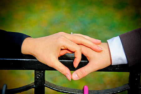 man and woman holding each other's hand thumbnail
