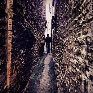 photo of man standing on hallway near wall thumbnail