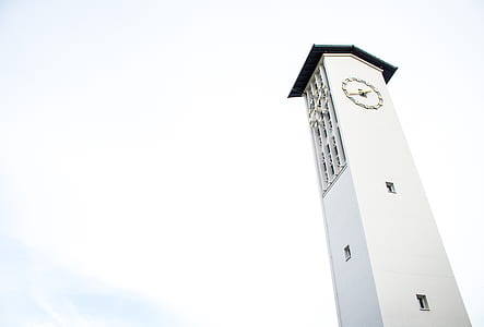 worm's eye-view photography of white concrete tower clock thumbnail