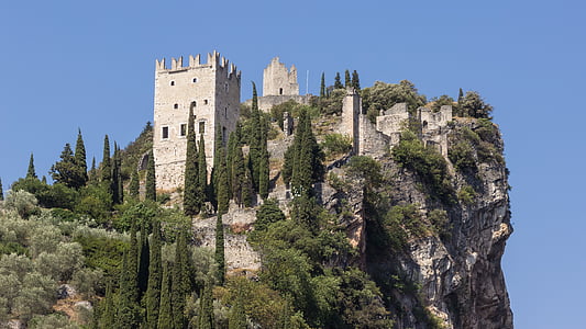 gray concrete tower on mountain thumbnail
