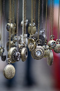 assorted pocket watches in shallow focus lens thumbnail