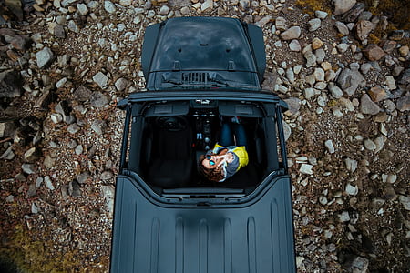 woman riding on black sports utility vehicle thumbnail