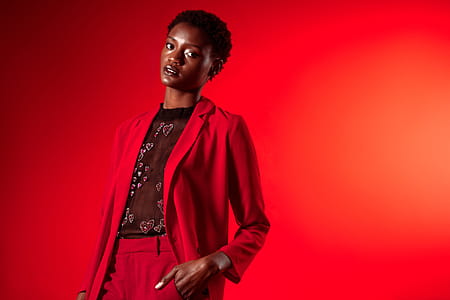 Model In Red Suit With Sheer Top Photo thumbnail
