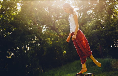 woman standing near trees thumbnail