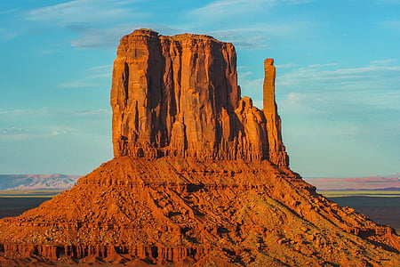 brown mountain under blue sky during daytime thumbnail