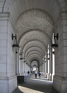 people walking on hallway taken during daytime thumbnail