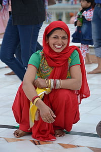 woman in red and green dress thumbnail