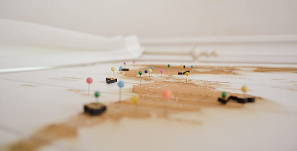 shallow focus photography of push pins pinned in white board thumbnail